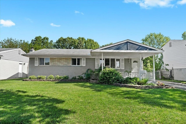35519 Canyon Dr, Westland, MI 48186 - view of front of home featuring a front lawn, brick siding, a porch, and a chimney