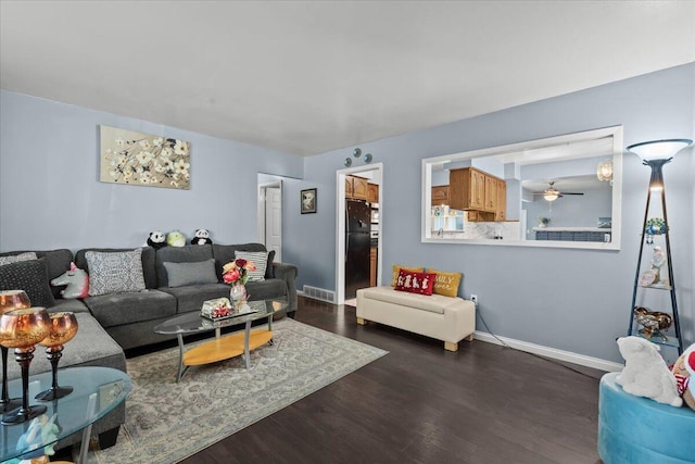 35519 Canyon Dr, Westland, MI 48186 - living room with dark wood-style floors and baseboards