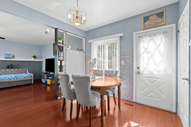 35519 Canyon Dr, Westland, MI 48186 - dining space featuring a chandelier and wood finished floors