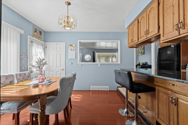 35519 Canyon Dr, Westland, MI 48186 - dining space featuring wood finished floors and a chandelier