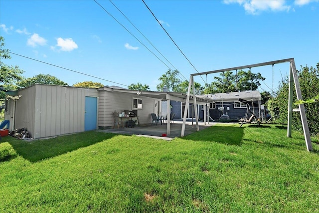 35519 Canyon Dr, Westland, MI 48186 - back of house featuring a patio area and a lawn