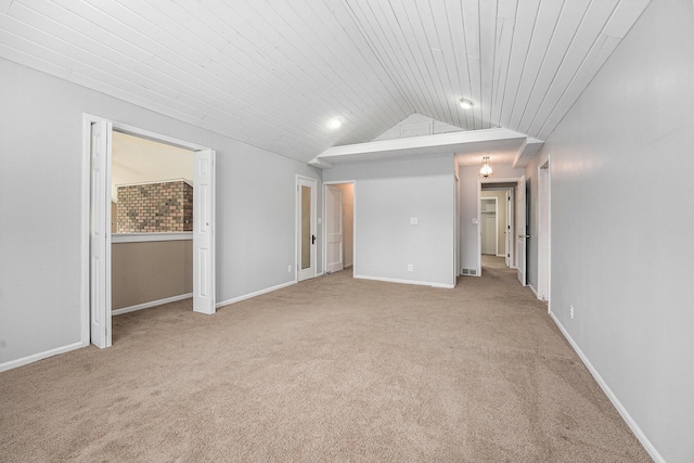5643 Ivanrest Ave SW, Wyoming, MI 49418 - unfurnished bedroom featuring light carpet, lofted ceiling, wood ceiling, and baseboards