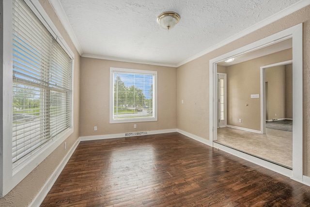 5643 Ivanrest Ave SW, Wyoming, MI 49418 - empty room with ornamental molding, hardwood / wood-style flooring, a textured ceiling, and baseboards