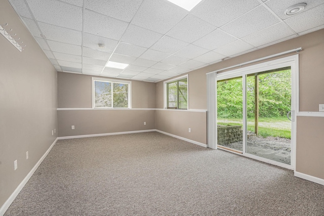 5643 Ivanrest Ave SW, Wyoming, MI 49418 - carpeted spare room featuring a drop ceiling and baseboards