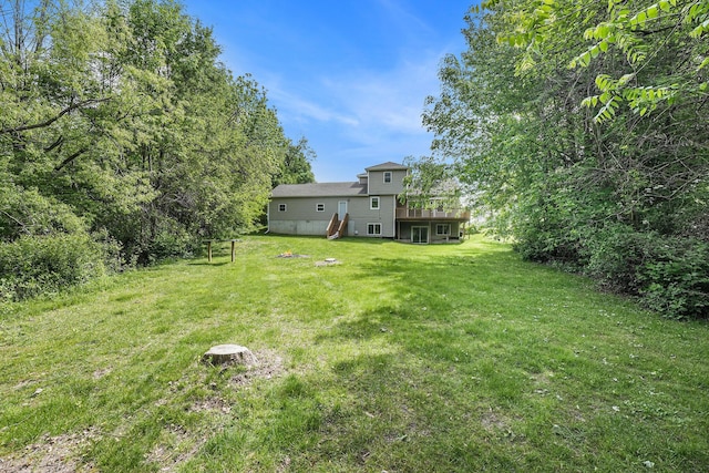 5643 Ivanrest Ave SW, Wyoming, MI 49418 - view of green lawn with a deck