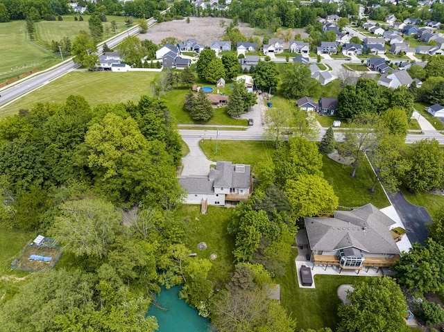 5643 Ivanrest Ave SW, Wyoming, MI 49418 - aerial overview of property's location with a nearby body of water and a tree filled landscape