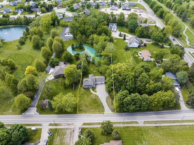 5643 Ivanrest Ave SW, Wyoming, MI 49418 - aerial view of residential area with property parcel outlined and a nearby body of water