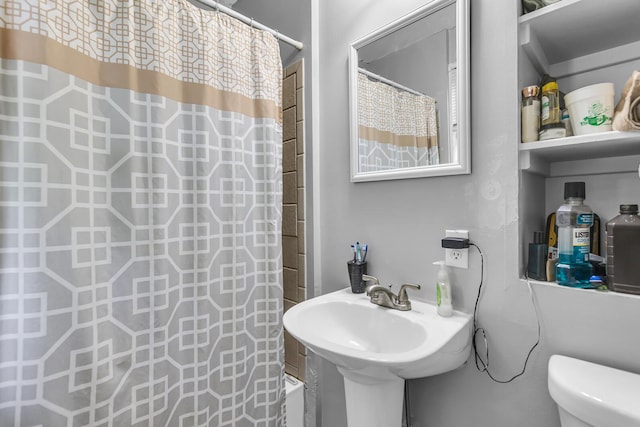 105 Renker Rd, Lansing, MI 48917 - bathroom with a shower with curtain, toilet, and a sink