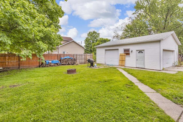 105 Renker Rd, Lansing, MI 48917 - view of yard featuring a garage and an outdoor structure