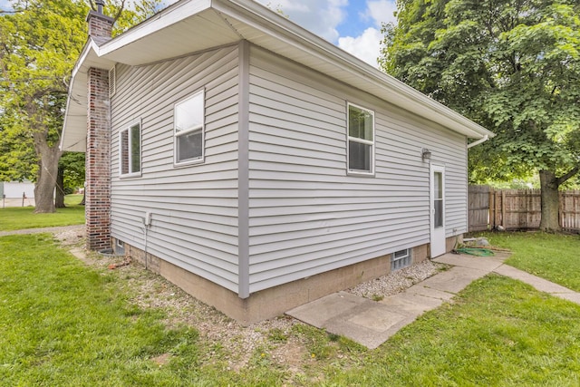 105 Renker Rd, Lansing, MI 48917 - view of side of home featuring a chimney