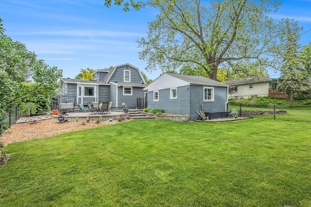 403 N Helen Ave, Rochester, MI 48307 - back of house featuring a patio area, a gambrel roof, and an outbuilding