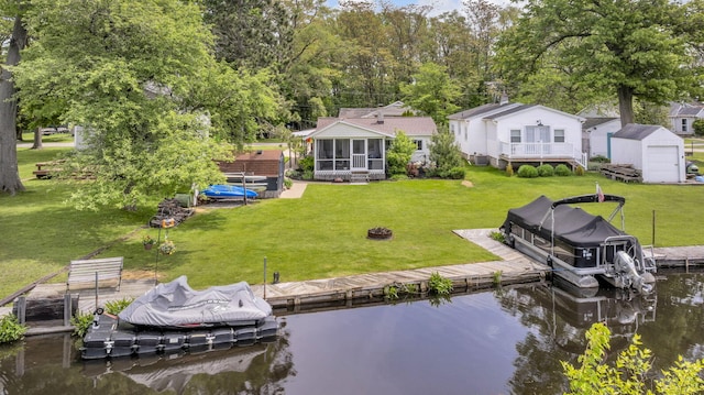 863 S Lakeside Dr, Michigan Center, MI 49254 - dock with a water view and a yard