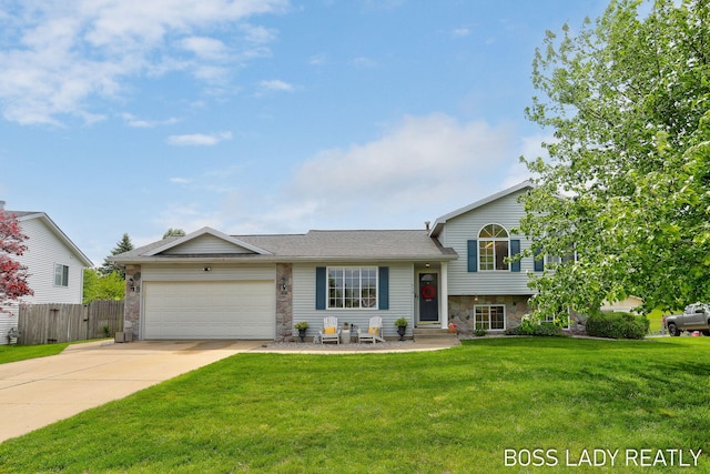 618 Sunmeadow Dr SE, Grand Rapids, MI 49508 - split level home featuring stone siding, an attached garage, and concrete driveway