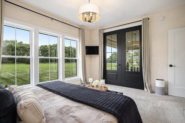 18919 I Dr N, Marshall, MI 49068 - carpeted bedroom featuring french doors, access to outside, and a chandelier