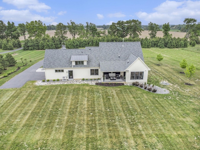 18919 I Dr N, Marshall, MI 49068 - back of house with a patio, a lawn, roof with shingles, and stucco siding