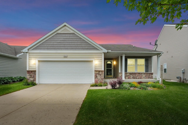 8761 Aveling Way, Richland, MI 49083 - ranch-style home with stone siding, a garage, driveway, and a front yard