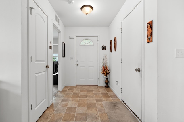 8761 Aveling Way, Richland, MI 49083 - foyer featuring light stone finish floors and baseboards