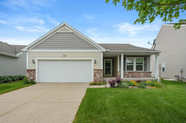 8761 Aveling Way, Richland, MI 49083 - view of front of property with stone siding, driveway, a front yard, a garage, and a porch
