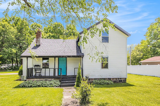 512 E Cass St, Schoolcraft, MI 49087 - view of front of home with covered porch, a chimney, and roof with shingles