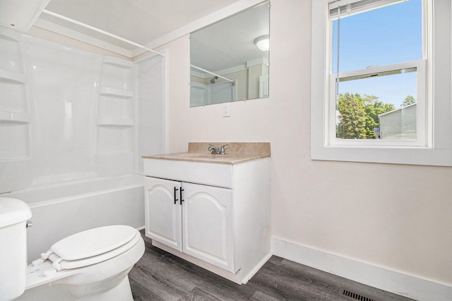 512 E Cass St, Schoolcraft, MI 49087 - full bathroom with toilet, wood finished floors, vanity, and plenty of natural light