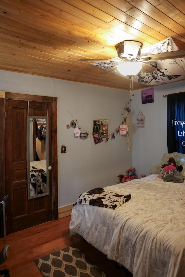1041 W Arthur Rd, Rothbury, MI 49452 - bedroom with wooden ceiling and wood finished floors