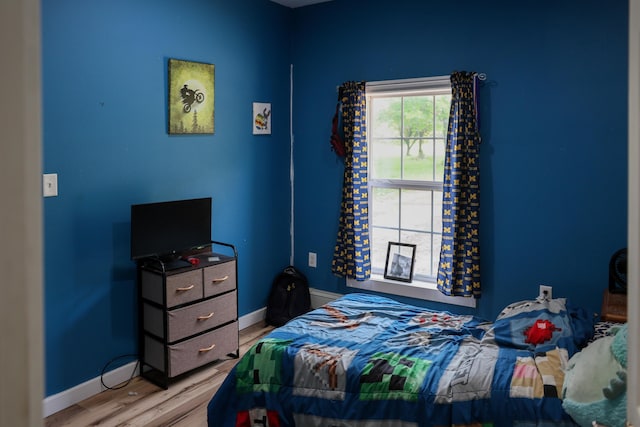 1041 W Arthur Rd, Rothbury, MI 49452 - bedroom with wood finished floors and baseboards