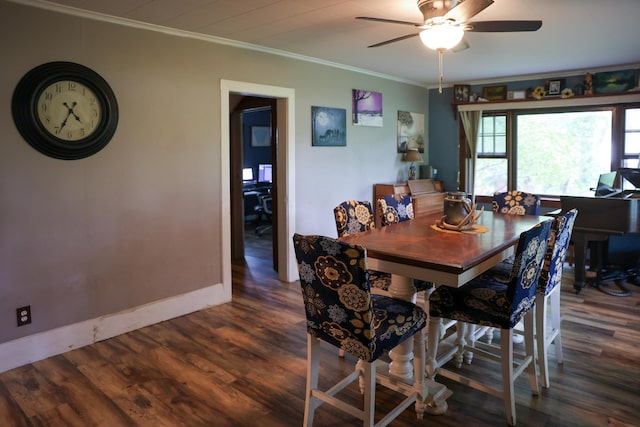 1041 W Arthur Rd, Rothbury, MI 49452 - dining area with ornamental molding, wood finished floors, ceiling fan, and baseboards