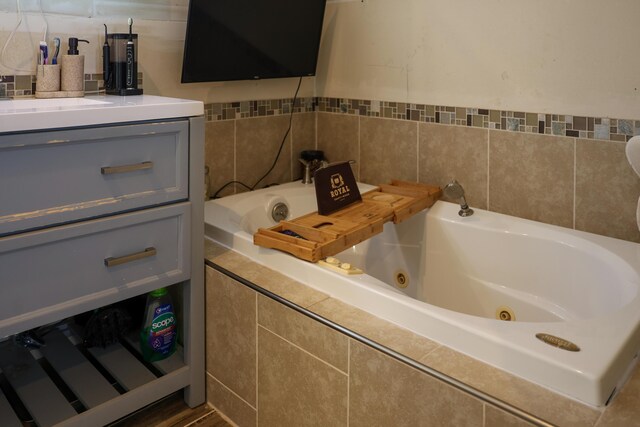 1041 W Arthur Rd, Rothbury, MI 49452 - full bath featuring a jetted tub and vanity