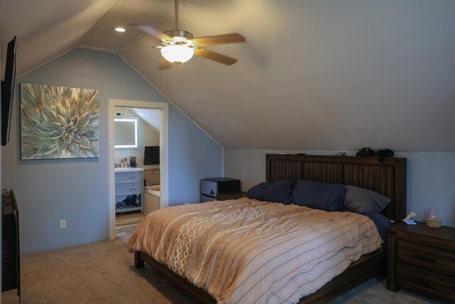 1041 W Arthur Rd, Rothbury, MI 49452 - carpeted bedroom featuring vaulted ceiling, ensuite bath, and a ceiling fan