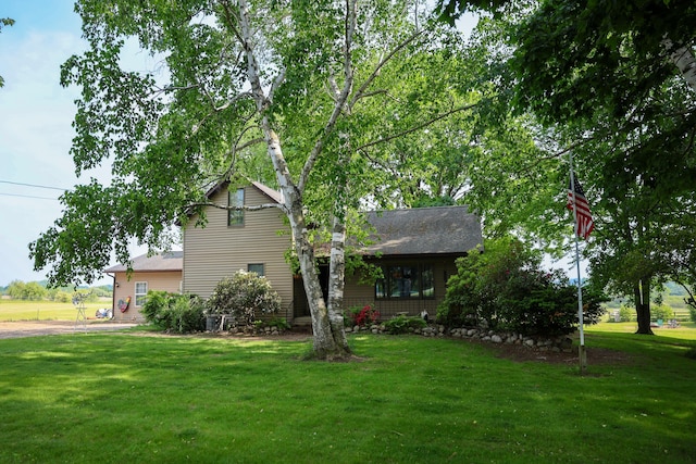1041 W Arthur Rd, Rothbury, MI 49452 - view of front of home with a front yard