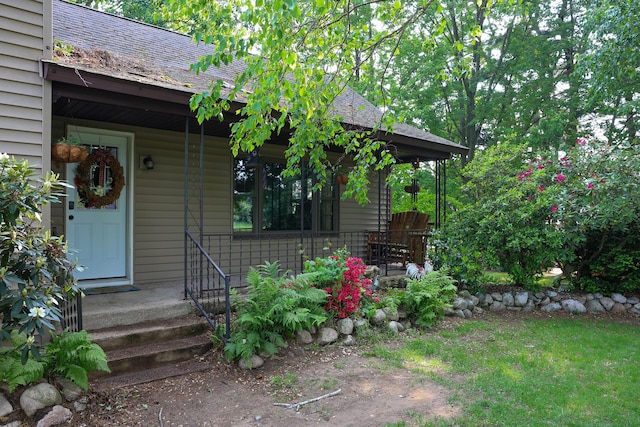 1041 W Arthur Rd, Rothbury, MI 49452 - entrance to property featuring a shingled roof