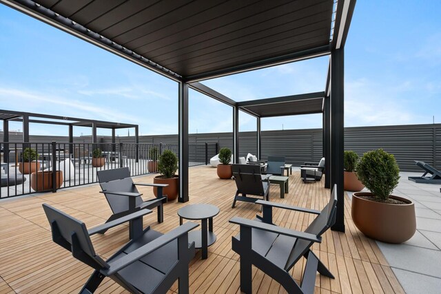144 Oakes St SW Unit 1903, Grand Rapids, MI 49503 - wooden terrace featuring an outdoor living space