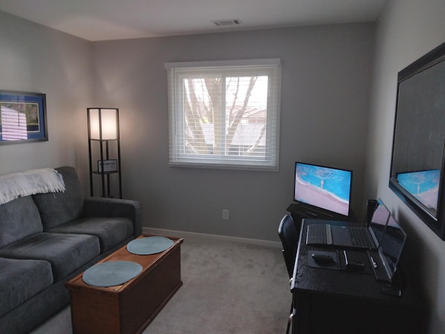 5230 Southbrook Ct Unit 78, Hudsonville, MI 49426 - carpeted living room featuring baseboards and a desk