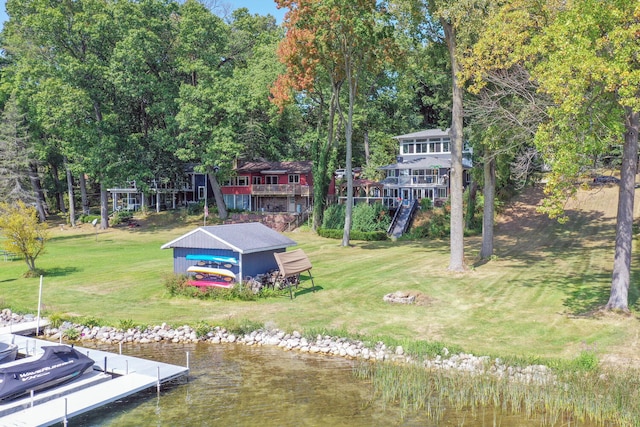 17437 Lakeview Dr Unit 100, Vandalia, MI 49095 - dock featuring a lawn and a water view