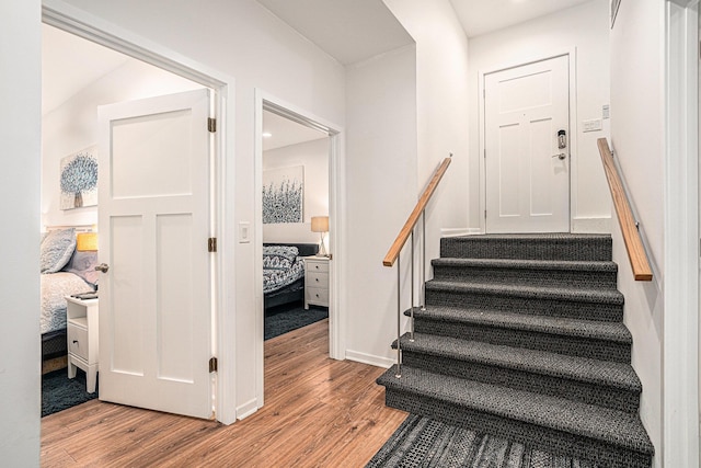 17437 Lakeview Dr Unit 100, Vandalia, MI 49095 - stairway featuring wood finished floors, baseboards, and recessed lighting