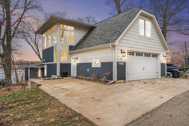 17437 Lakeview Dr Unit 100, Vandalia, MI 49095 - view of side of property with a shingled roof and concrete driveway