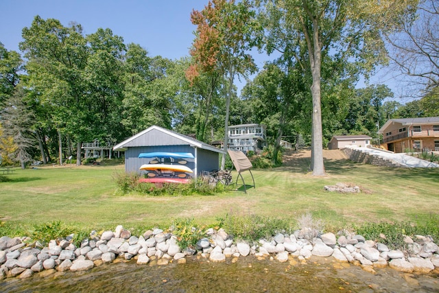 17437 Lakeview Dr Unit 100, Vandalia, MI 49095 - view of green lawn featuring view of wooded area and an outbuilding