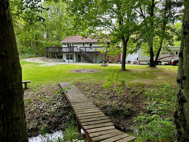 1566 N Fitzgerald Ave, Hesperia, MI 49421 - view of yard with stairs and a wooden deck