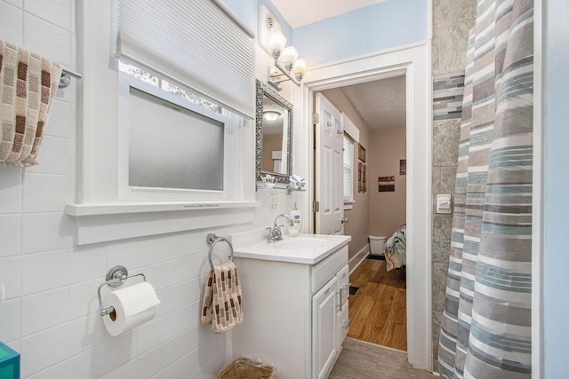 208 Nelson Ave, Kalamazoo, MI 49006 - full bathroom featuring vanity and wood finished floors