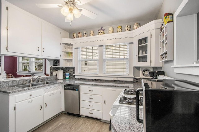 208 Nelson Ave, Kalamazoo, MI 49006 - kitchen featuring stainless steel dishwasher, a sink, black microwave, light wood-type flooring, and open shelves