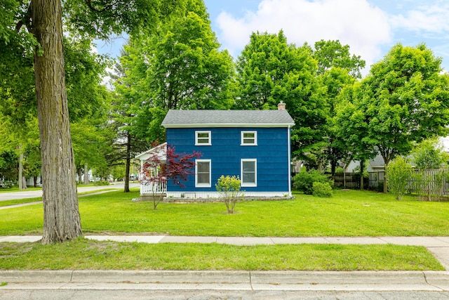 115 Mckinley St, Chelsea, MI 48118 - view of front facade featuring a chimney and roof with shingles