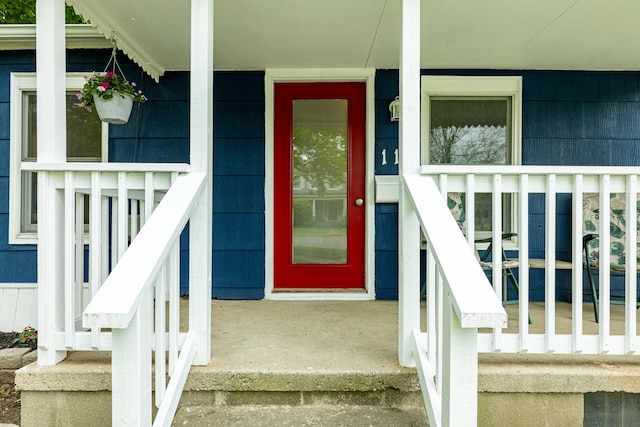 115 Mckinley St, Chelsea, MI 48118 - view of exterior entry with a porch