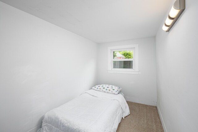 115 Mckinley St, Chelsea, MI 48118 - carpeted bedroom featuring baseboards