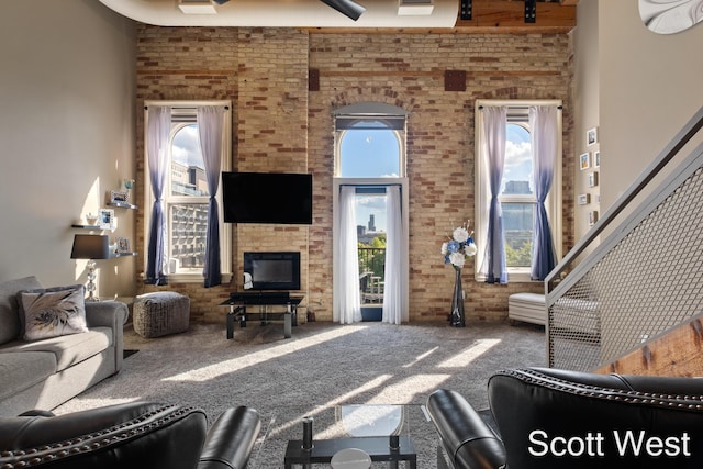 801 Monroe Ave NW Unit 402, Grand Rapids, MI 49503 - living room featuring brick wall, carpet, and a glass covered fireplace