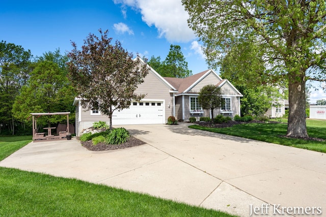 7153 Keystone Ct, Jenison, MI 49428 - view of front facade with concrete driveway, a garage, and a front lawn