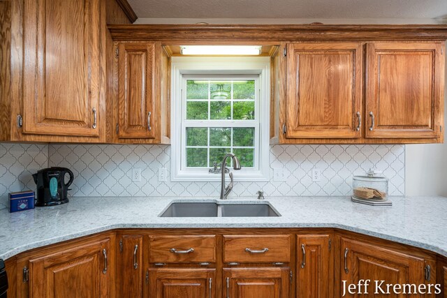 7153 Keystone Ct, Jenison, MI 49428 - kitchen with a sink and brown cabinetry