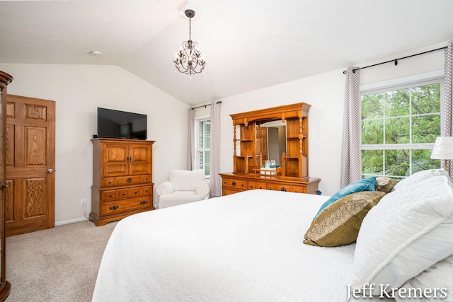 7153 Keystone Ct, Jenison, MI 49428 - bedroom featuring lofted ceiling, carpet flooring, a chandelier, and baseboards