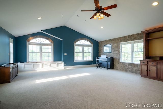 9318 Jefferson Rd, Lakeview, MI 48850 - carpeted living area featuring plenty of natural light, lofted ceiling, ceiling fan, recessed lighting, and brick wall