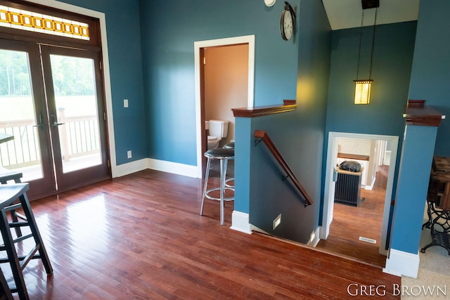 9318 Jefferson Rd, Lakeview, MI 48850 - foyer entrance featuring french doors, healthy amount of natural light, wood finished floors, baseboards, and a high ceiling