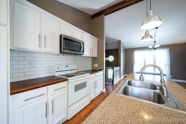 9318 Jefferson Rd, Lakeview, MI 48850 - kitchen featuring stainless steel microwave, white electric range oven, a sink, decorative backsplash, and white cabinets